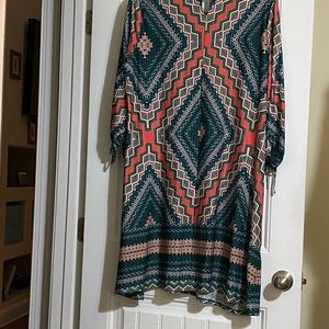 Knee-length pink and green dress with drawstrings on the sleeves.